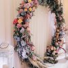Eternal Bloom wedding arch with fresh flowers and greenery in Edmonton