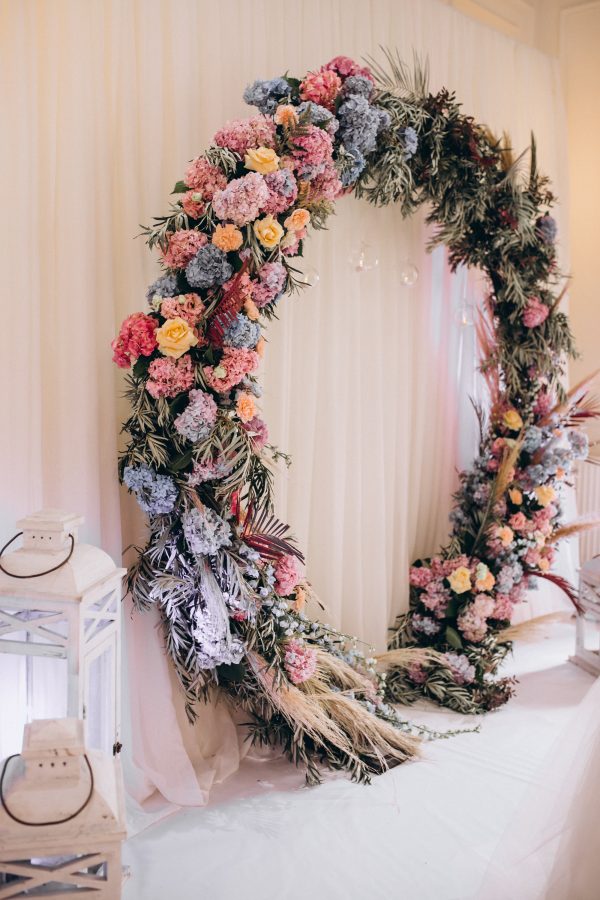Eternal Bloom wedding arch with fresh flowers and greenery in Edmonton