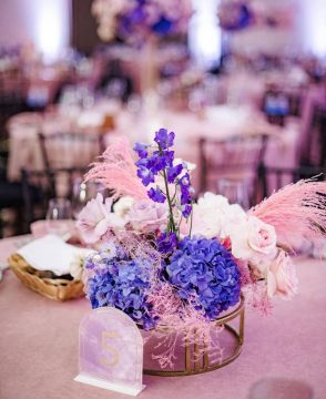 Lavender Glow wedding table arrangement with hydrangea, roses, and dried accents in Edmonton