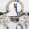 Eternal Sky round wedding arch with white roses, blue hydrangeas, and greenery in Edmonton
