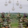 Orchard Elegance wedding ceremony setup with flowers, fruits, and chandeliers in Edmonton