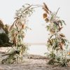 Golden Dunes wedding arch with fresh flowers, greenery, and dried elements in Edmonton