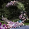 Moonlight Symphony crescent wedding arch with pastel roses, purple flowers, and celestial décor in Edmonton