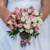 Pink and white spray rose wedding bouquet with greenery in Edmonton
