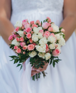 Pink and white spray rose wedding bouquet with greenery in Edmonton