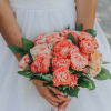Coral Elegance wedding bouquet with coral and ivory roses and greenery in Edmonton
