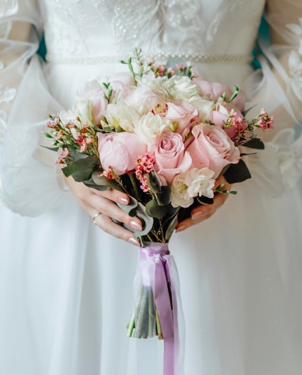 Romantic Whisper wedding bouquet with peonys, roses, lisianthus, and waxflower in Edmonton