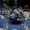 Midnight Symphony wedding table arrangement with blue and lavender flowers in Edmonton